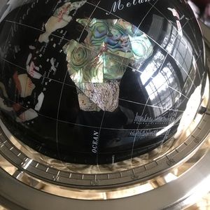 Beautiful mother of Pearl tabletop globe Metal base. 13” X 9”.